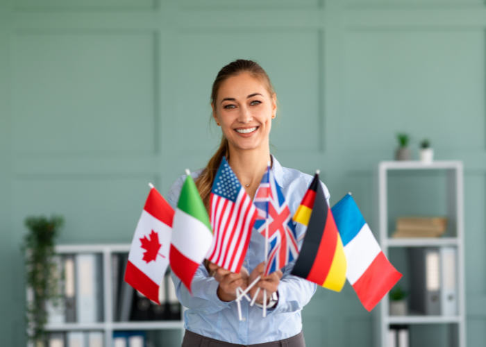 Female Student Holding Various Country Flags
